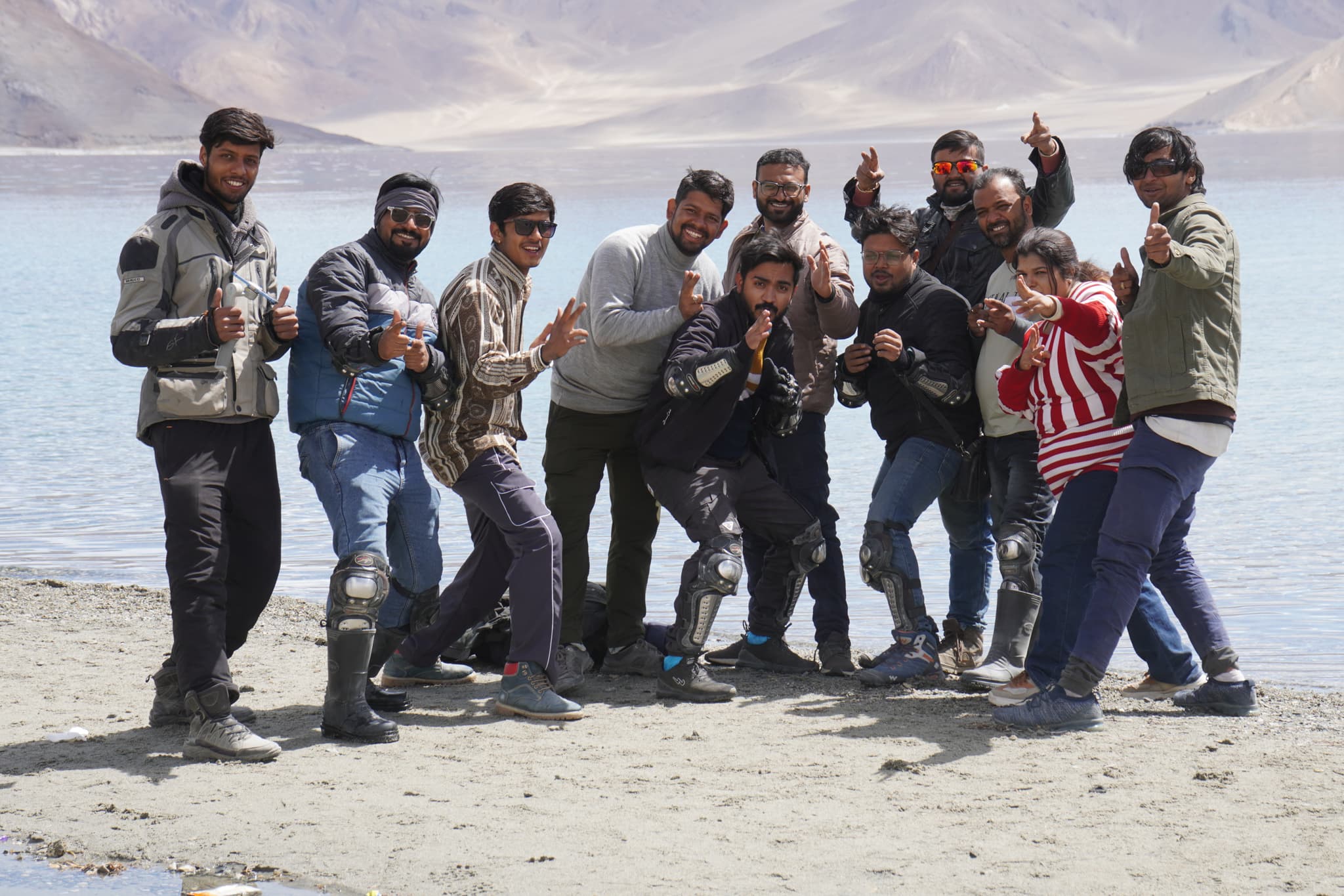 MountainBea expedition group photo at Pangong Tso — Leh Ladakh bike tour